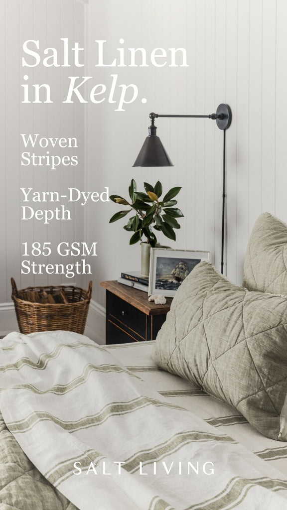 Living room with Salt Linen in Kelp, featuring a lamp, plant, and furniture.