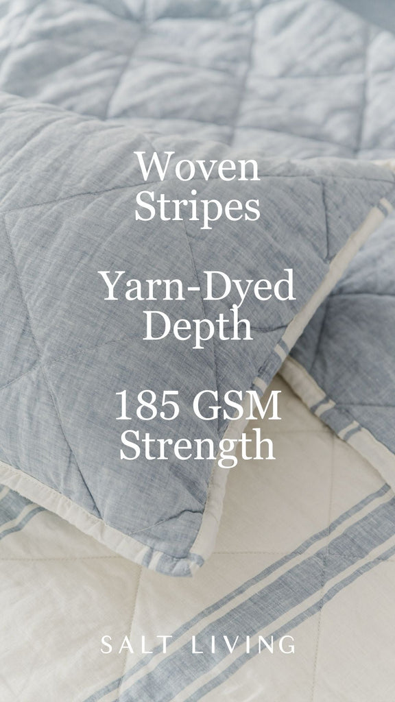 French Blue quilted shams styled on a coastal bed